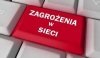 Klawiatura komputerowa i jeden klawisz koloru czerwonego napis zagrożenia w sieci