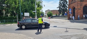 Policjanci ruchu drogowego podczas zabezpieczenia procesji